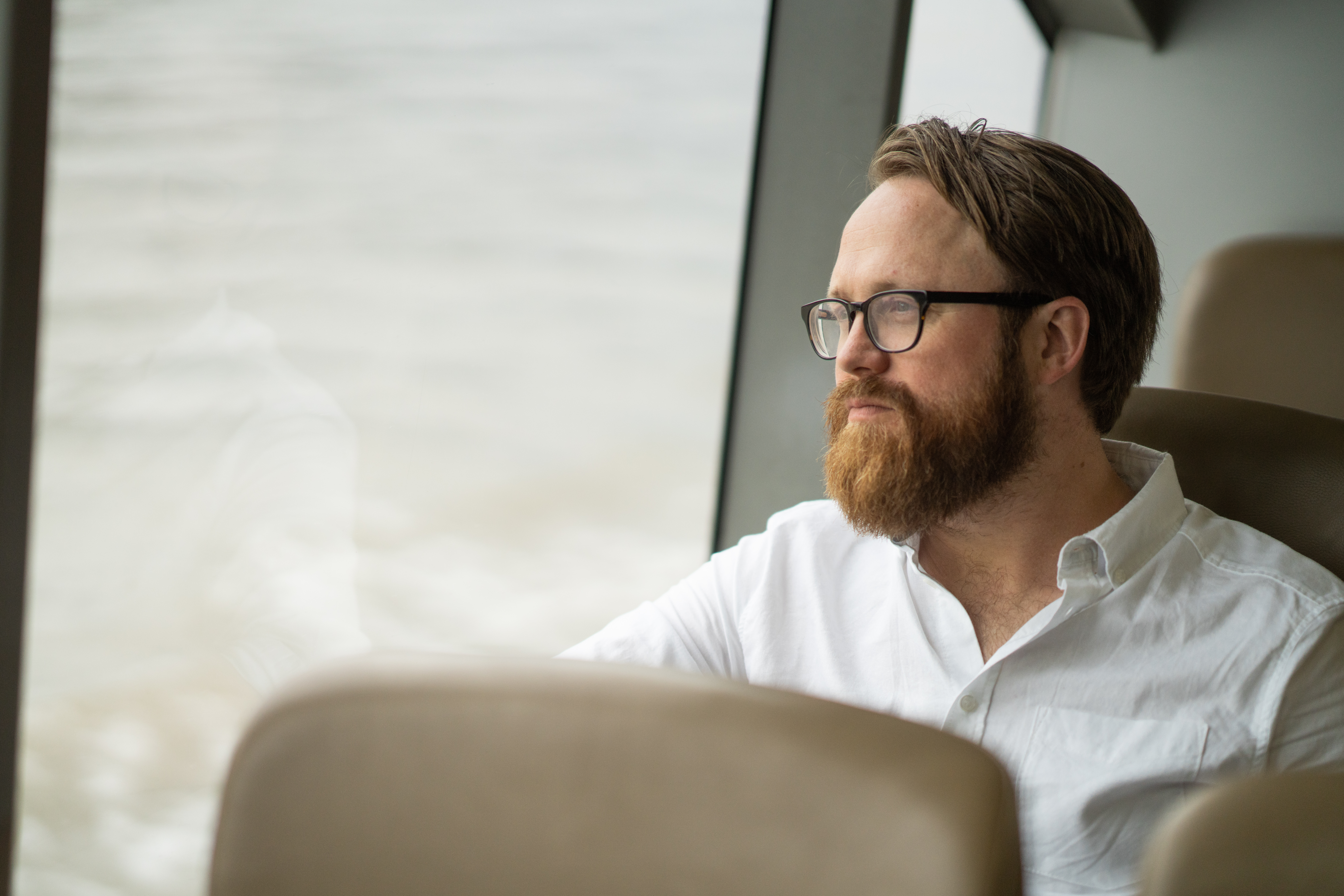 Man seating by the window
