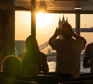 Passengers Photographing Sunset